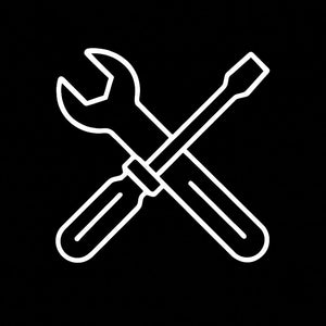 Appliance repair tools, including screwdriver and wrench.
